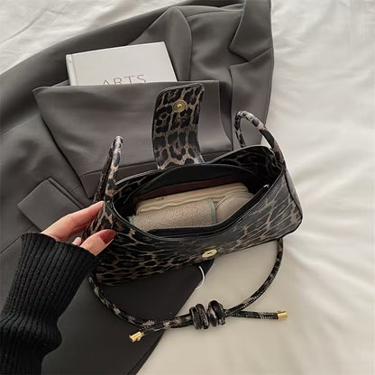 Petit sac à main bandoulière baguette motif léopard avec nœud papillon doré Élise