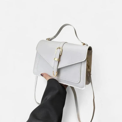 Petit sac à main bandoulière à rabat aux finitions doré Castille