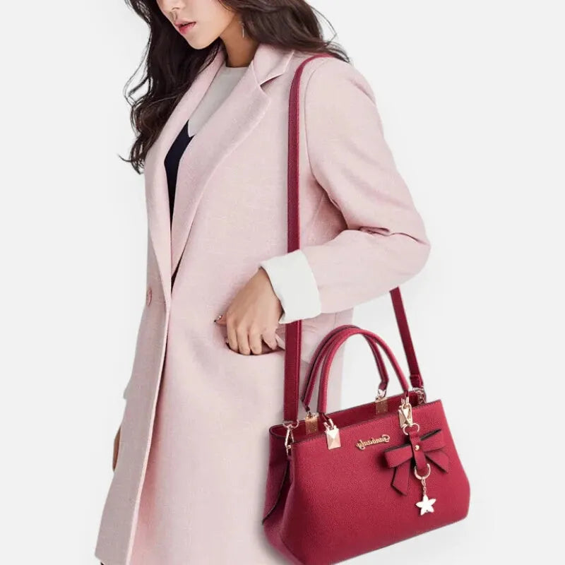 Petit sac à main bandoulière avec son charms noeud et fleur Léana