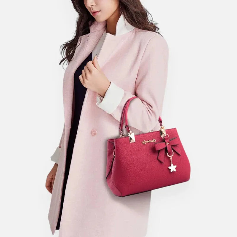 Petit sac à main bandoulière avec son charms noeud et fleur Léana