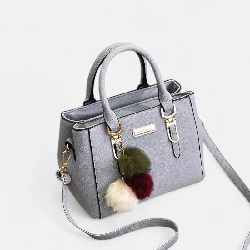 Petit sac à main bandoulière avec son charms pompon Louna