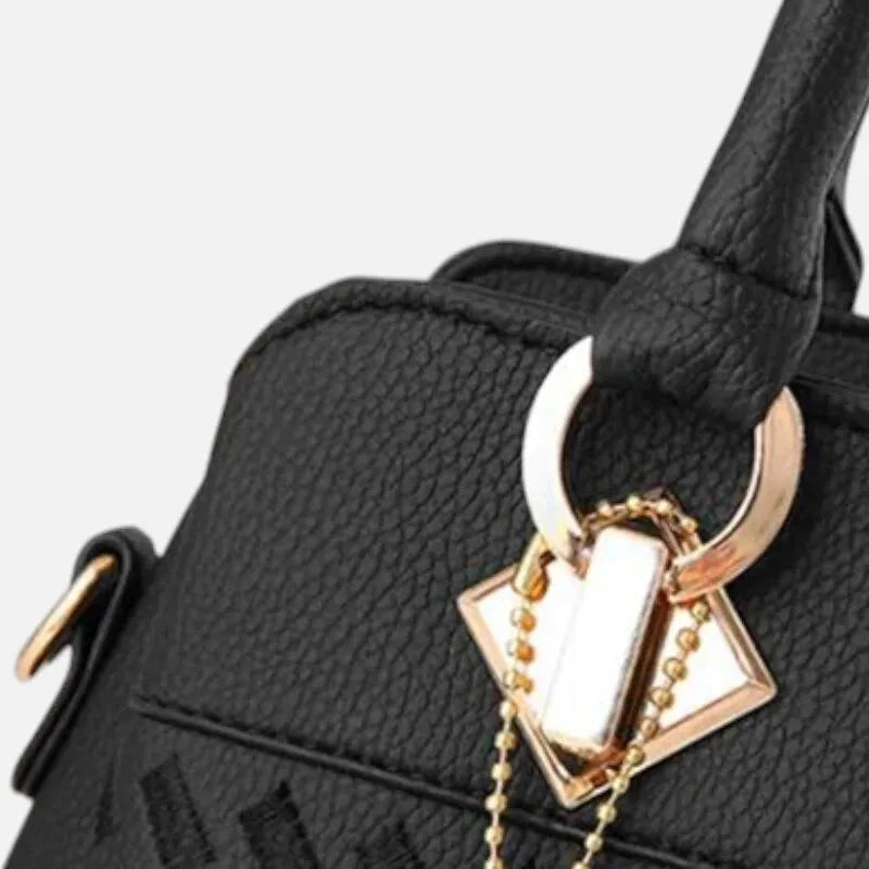 Sac à main bandoulière avec son charms doré assortie Ludovica