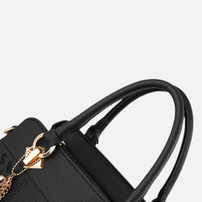 Sac à main bandoulière avec son charms doré assortie Ludovica